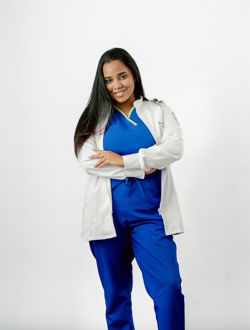 nurse in scrubs with arms crossed 